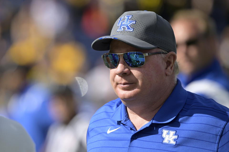 Kentucky head coach Mark Stoops watches players warm up before the Citrus Bowl NCAA college football game against Iowa, Saturday, Jan. 1, 2022, in Orlando, Fla. (AP Photo/Phelan M. Ebenhack)