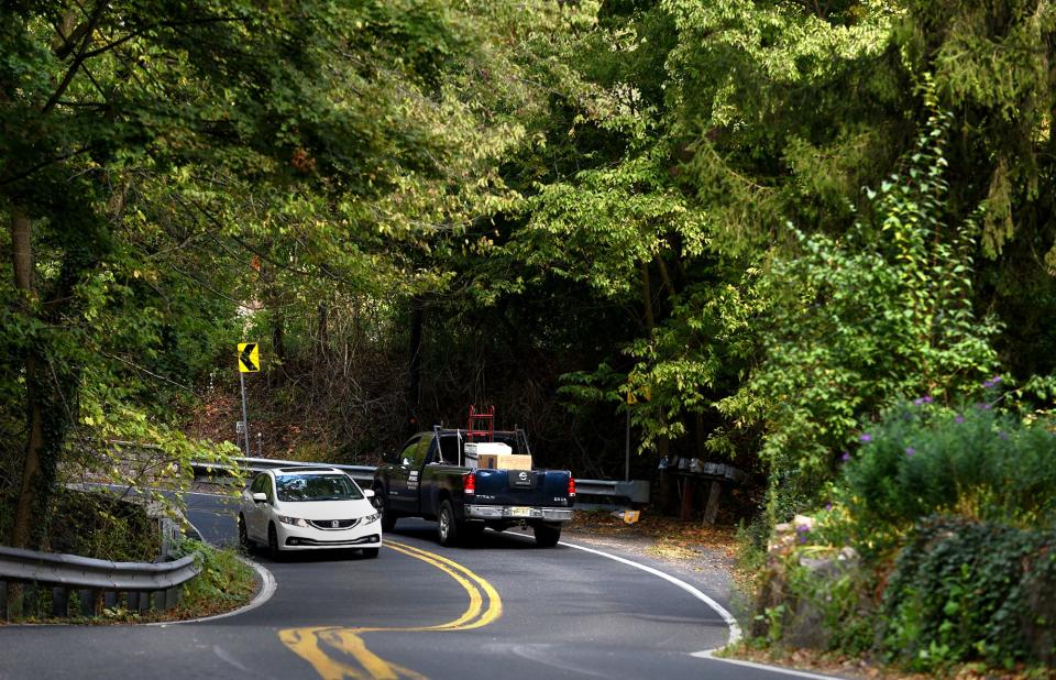 Motorists navigate a curve on River Road in Solebury Township. Leaves will begin changing soon, and a drive down River Road is a perfect way to see them.