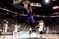 Phoenix Suns power forward Markieff Morris (11) dunks the ball against the San Antonio Spurs during the second half at AT&T Center. Mandatory Credit: Soobum Im-USA TODAY Sports