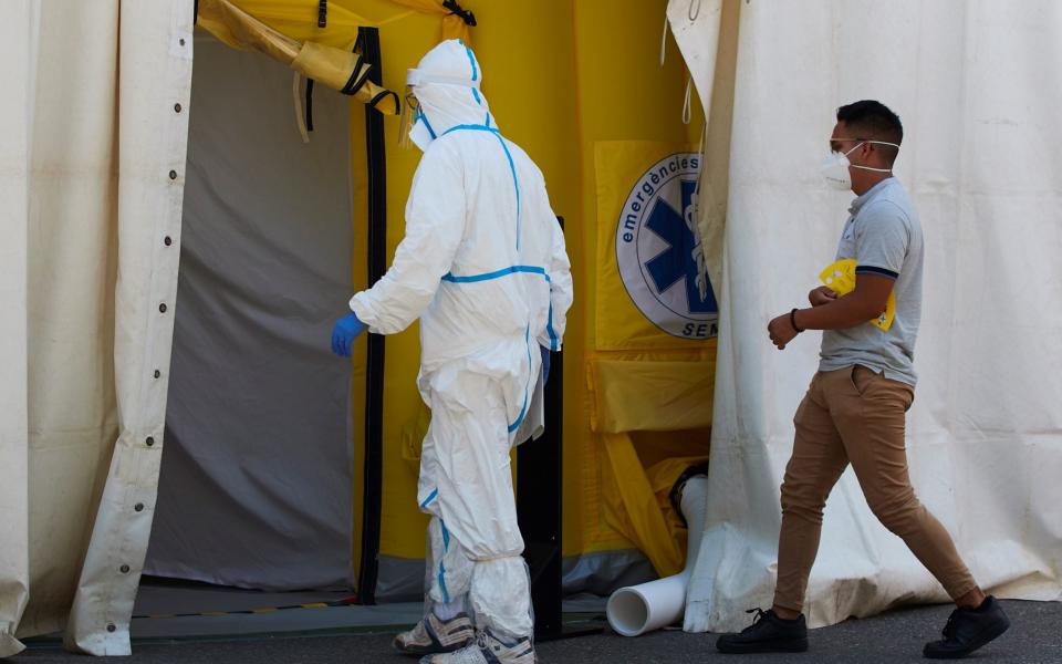 Sanitary personnel receive patients at a provisional hospital at Prat de la Riba in Lleida, Catalonia - Alejandro Garcia/EPA-EFE/Shutterstock/Shutterstock