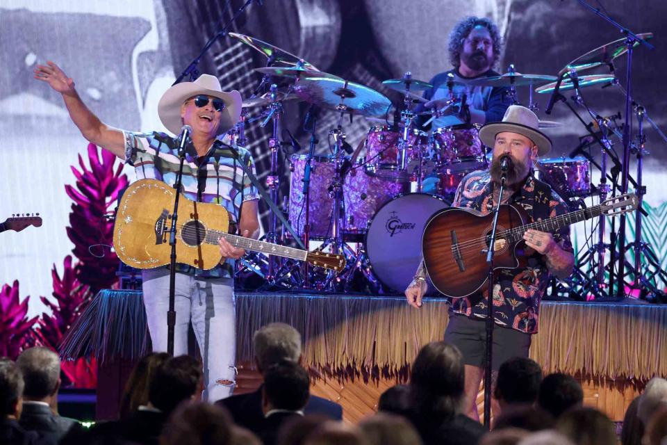 <p>Terry Wyatt/Getty</p> Alan Jackson and Zac Brown performing a tribute to Jimmy Buffett at the 2023 CMA Awards