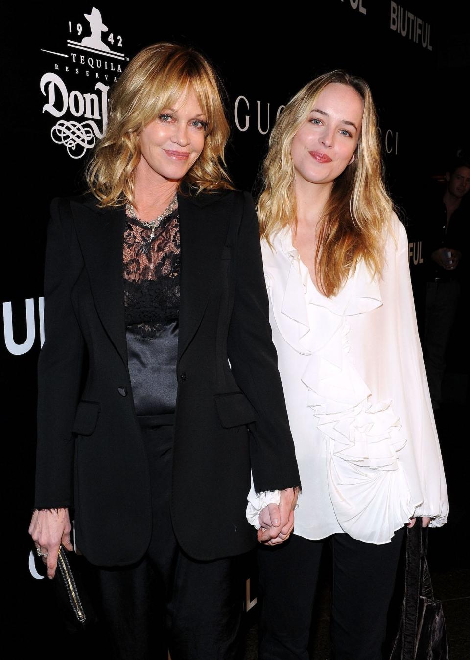 Melanie Griffith and Dakota Johnson on a red carpet in 2010.