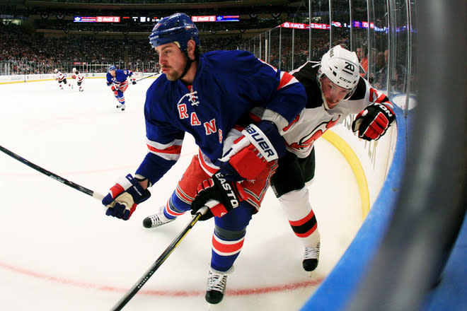 NEW YORK, NY - MAY 23: Brandon Dubinsky #17 of the New York Rangers and Ryan Carter #20 of the New Jersey Devils vie for the puck in Game Five of the Eastern Conference Final during the 2012 NHL Stanley Cup Playoffs at Madison Square Garden on May 23, 2012 in New York City. (Photo by Bruce Bennett/Getty Images)