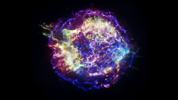 Buried under layers of glowing, multi-colored gas, at the heart of supernova remnant Cassiopeia A, are massive caverns carved out by radioactive metal, according to new research.