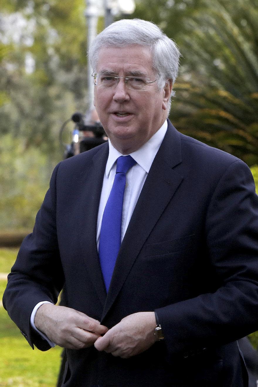 British Defense Minister Michael Fallon arrives at the presidential palace for a meeting with a Cypriot President Nicos Anastasiades in capital Nicosia, in the eastern Mediterranean island of Cyprus, on Friday, Feb. 10, 2017. Britain's defense secretary says the role played the UK's two military bases on Cyprus are "more important than ever" because of the rise of extremist terror and mass migration flows coming from the region. (AP Photo/Petros Karadjias)