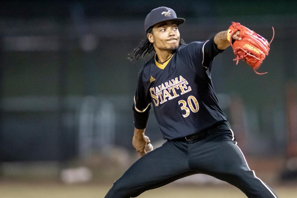 Alabama State pitcher Breon Pooler (30) pitches against Florida A&M during an NCAA baseball game on Friday, March 18, 2022, in Montgomery, Ala. (AP Photo/Vasha Hunt)