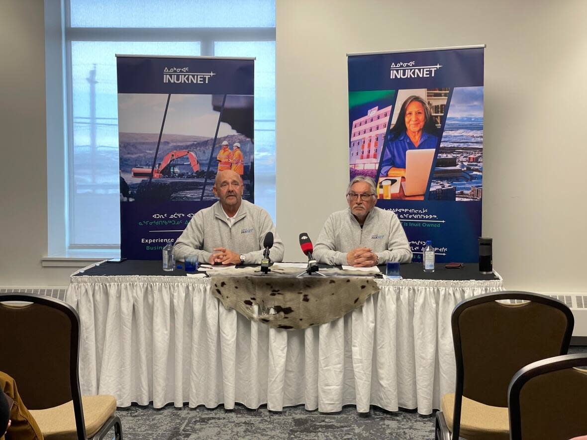 Rick Hodgkinson, left, CEO of Galaxy Broadband and Harry Flaherty, Qikiqtaaluk Corporation president, announce the launch of InukNet at a press conference in Iqaluit on Thursday.  (David Gunn/CBC  - image credit)