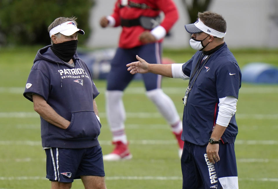 FOXBOROUGH, MASSACHUSETTS - AUGUST 17: Head coach Bill Belichick of the New England Patriots talks with offensive coordinator Josh McDaniels during training camp at Gillette Stadium on August 17, 2020 in Foxborough, Massachusetts. (Photo by Steven Senne-Pool/Getty Images)