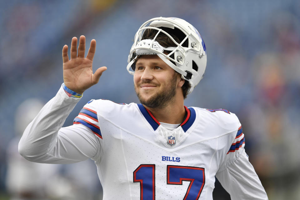 FILE - Buffalo Bills quarterback Josh Allen waves before an NFL preseason football game against the Indianapolis Colts in Orchard Park, N.Y., Saturday, Aug. 12, 2023. Allen has become accustomed to having his public life picked over and documented with his star status in Buffalo and beyond showing no signs of cresting. (AP Photo/Adrian Kraus, File)