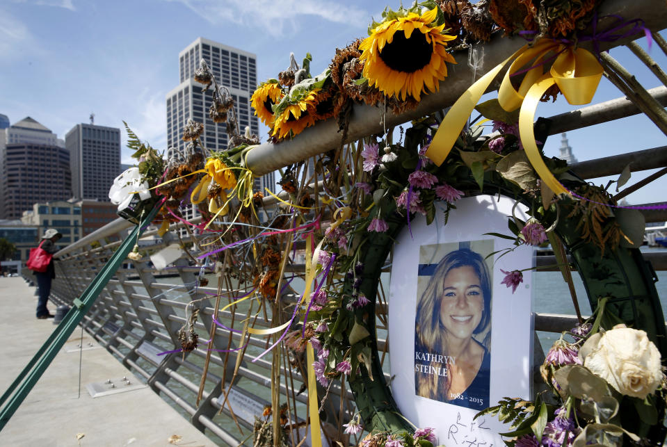 FILE - In this July 17, 2015 file photo, flowers and a portrait of Kate Steinle remain at a memorial site on Pier 14 in San Francisco. Jose Ines Garcia-Zarate, a Mexican national who touched off a fierce immigration debate for his role in the shooting death of Steinle, is seeking to overturn his felony illegal gun possession conviction, the only charge he was found guilty of after a jury acquitted him of murder. (Paul Chinn/San Francisco Chronicle via AP, File)