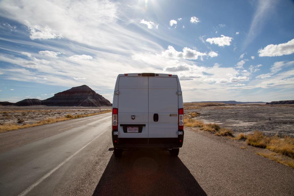 A van on an empty road.