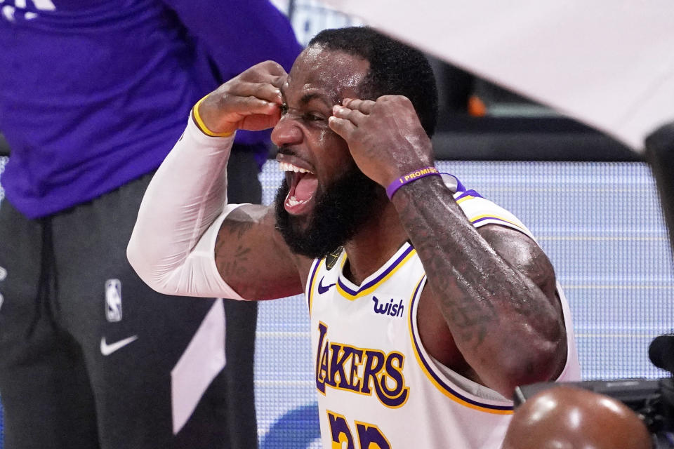 Los Angeles Lakers' LeBron James (23) celebrates after the Lakers defeated the Miami Heat 106-93 in Game 6 of basketball's NBA Finals Sunday, Oct. 11, 2020, in Lake Buena Vista, Fla. (AP Photo/Mark J. Terrill)