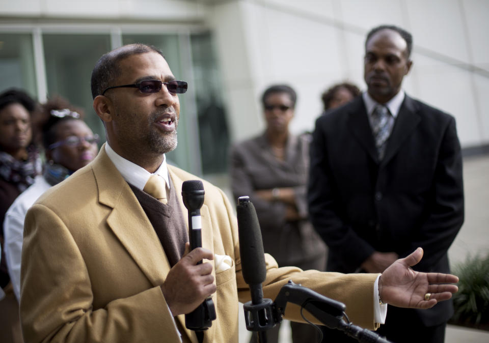 FILE - Sapelo Island, Ga., descendant and land owner Reginald Hall speaks at a news conference outside federal court, Dec. 9, 2015, in Atlanta. One of the few remaining Gullah-Geechee communities in the U.S. is in another fight to hold onto land owned by residents' families since their ancestors were freed from slavery. The few dozen remaining residents of the tiny Hogg Hummock community on Georgia's Sapelo Island were stunned when they learned county officials may end zoning protections enacted nearly 30 years ago to protect the enclave from wealthy buyers and tax increases. (AP Photo/David Goldman, File)