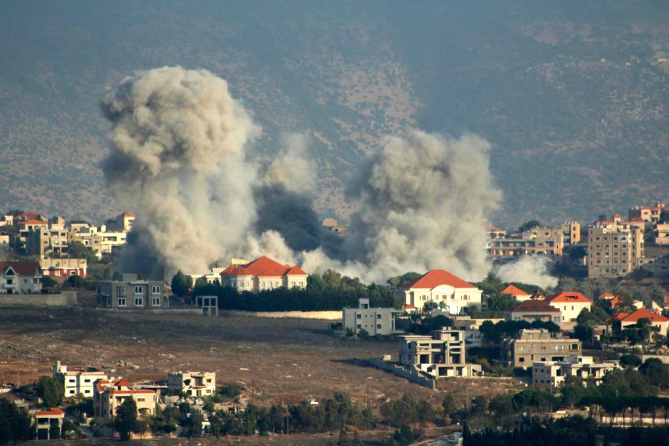 A plume of smoke billows in Khiam, southeastern Lebanon, following an Israeli air strike on Monday (AFP via Getty Images)