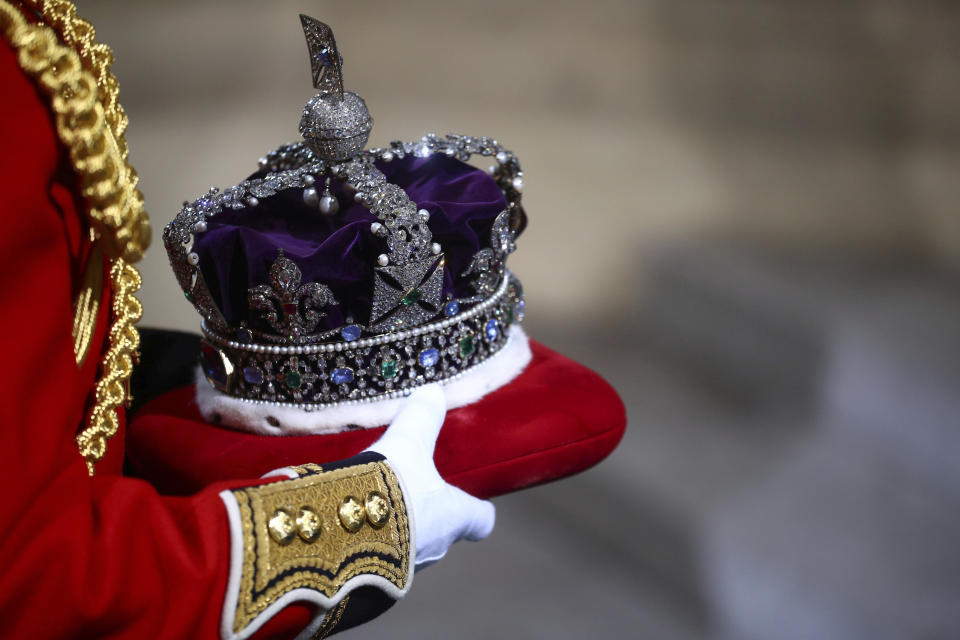 The crown of Britain's Queen Elizabeth II is carried to the official State Opening of Parliament in London, Monday Oct. 14, 2019. (Hannah McKay/Pool via AP)