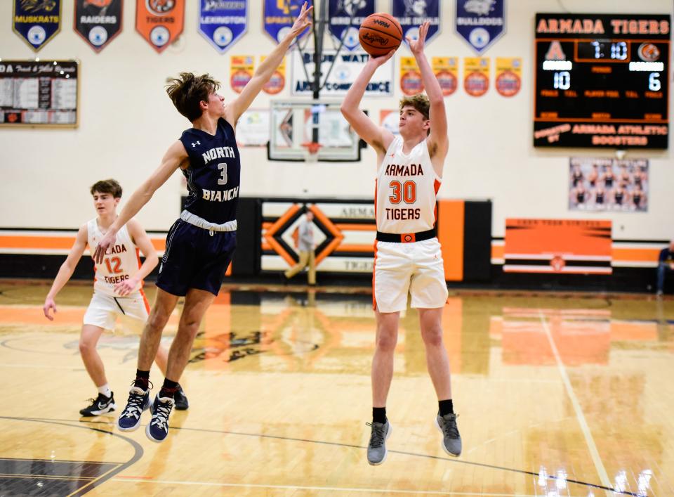 Armada's Preston Hill attempts a field goal during Armada's 59-41 home win over North Branch at Armada High School on Friday, Feb. 11, 2022.