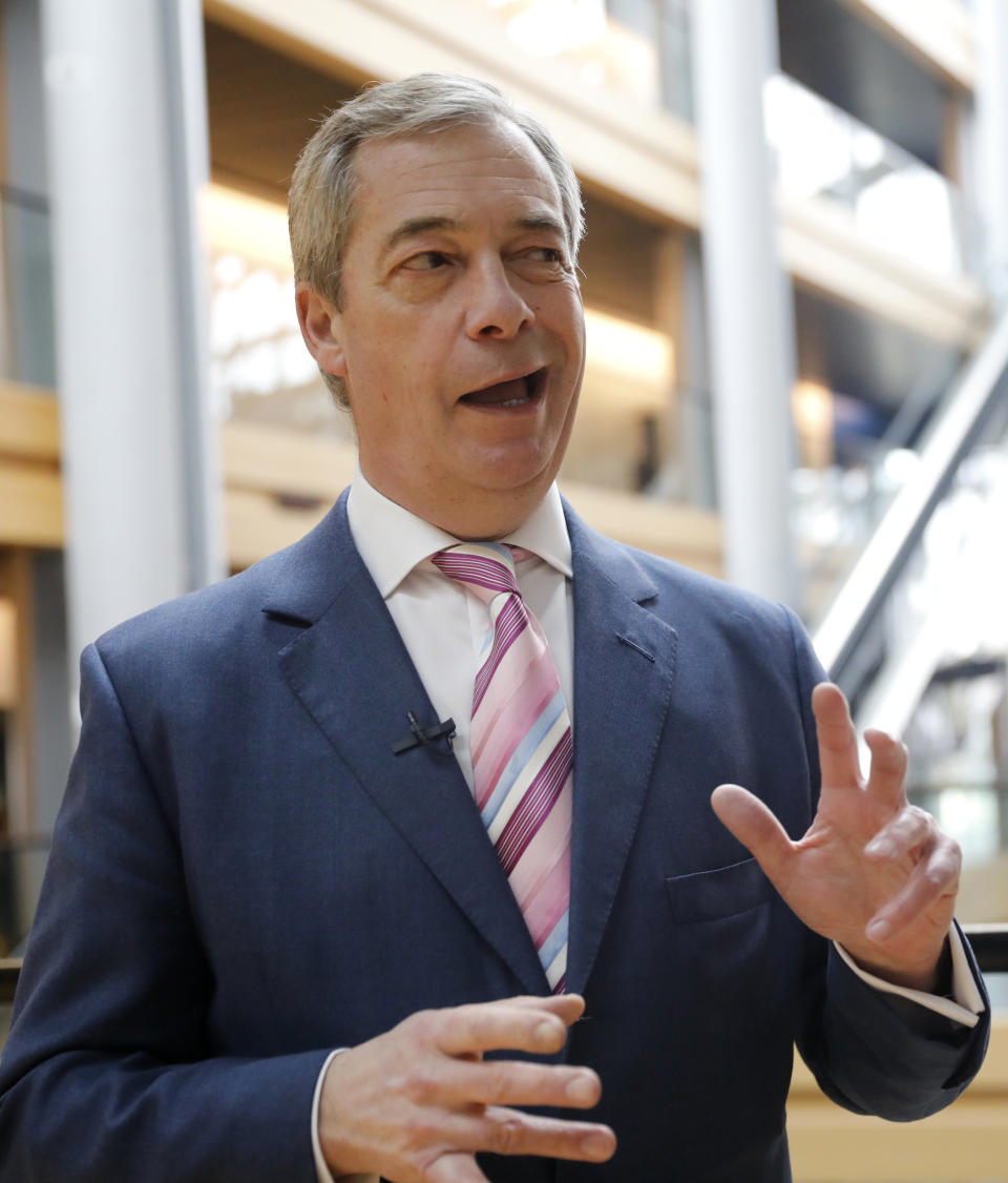 Nigel Farage, the leader of the Brexit Party, answers reporters at the European parliament Tuesday, Jan.14, 2020 in Strasbourg, eastern France. (AP Photo/Jean-Francois Badias)