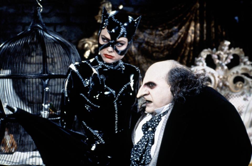 michelle pfiffer in leather as catwoman and danny devito in a prosthetic nose as the penguin in batman returns