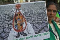 Activists belonging to various farmers rights organisations stage an anti-government demonstration to protest against the recent passing of new farm bills in parliament, in Bangalore on September 28, 2020. (Photo by Manjunath Kiran / AFP) (Photo by MANJUNATH KIRAN/AFP via Getty Images)