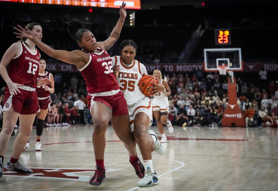 Texas' Madison Booker drives past Oklahoma's Sahara Williams in the second half Wednesday. The Longhorns' late rally came up short.