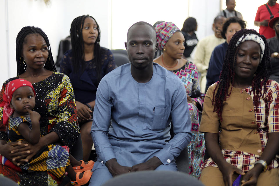 Jummai Mutah, left, and Amina Ali, right, Chibok schoolgirls who were kidnapped in 2014 by Islamic extremists and later released, attend a 10th anniversary event of the abduction in Lagos, Nigeria, Thursday, April 4, 2024.A new film in Nigeria is being screened to remember the nearly 100 schoolgirls who are still in captivity 10 years after they were seized from their school in the country’s northeast. At least 276 girls were kidnapped during the April 2014 attack, but most have since regained their freedom. (AP Photo/Mansur Ibrahim )