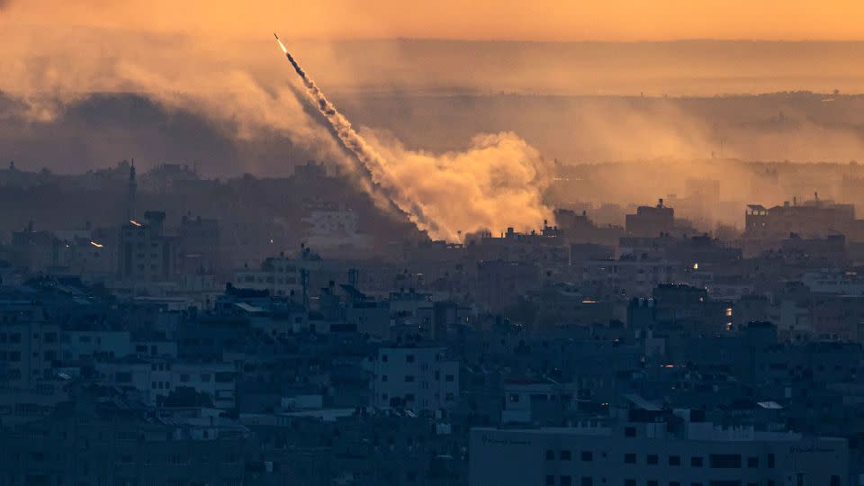 Rockets are fired toward Israel from the Gaza Strip on Saturday, October 7. - Fatima Shbair/AP