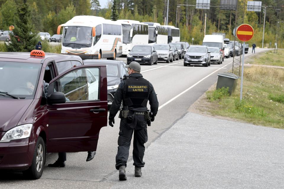 FILE - Finnish border guards check a Russian vehicle at the Vaalimaa border check point in Virolahti, Finland, on Sept. 25, 2022. Expulsions of Russian intelligence officers and visa refusals have substantially weakened Moscow’s intelligence operations in neighboring Finland in the past year, the Finnish Security and Intelligence Service said Thursday, March 30, 2023. (Jussi Nukari/Lehtikuva via AP, File)