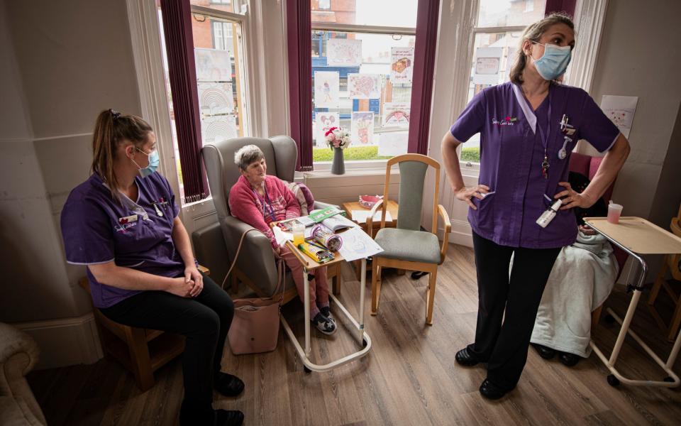 Margaret Davies, a resident at St Ceciliaâs Nursing Home, Scarborough, talks with staff.  - Simon Townsely