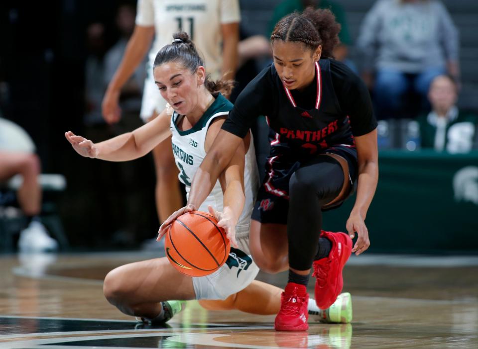 Michigan State's Abbey Kimball, left, gets a steal against Davenport's Amyah Espanol, Thursday, Nov. 2, 2023, in East Lansing, Mich.