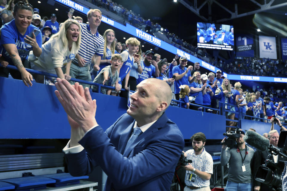 Mark Pope greets fans after being named head coach of the Kentucky men's basketball team in Lexington, Ky., Sunday, April 14, 2024. (AP Photo/James Crisp)