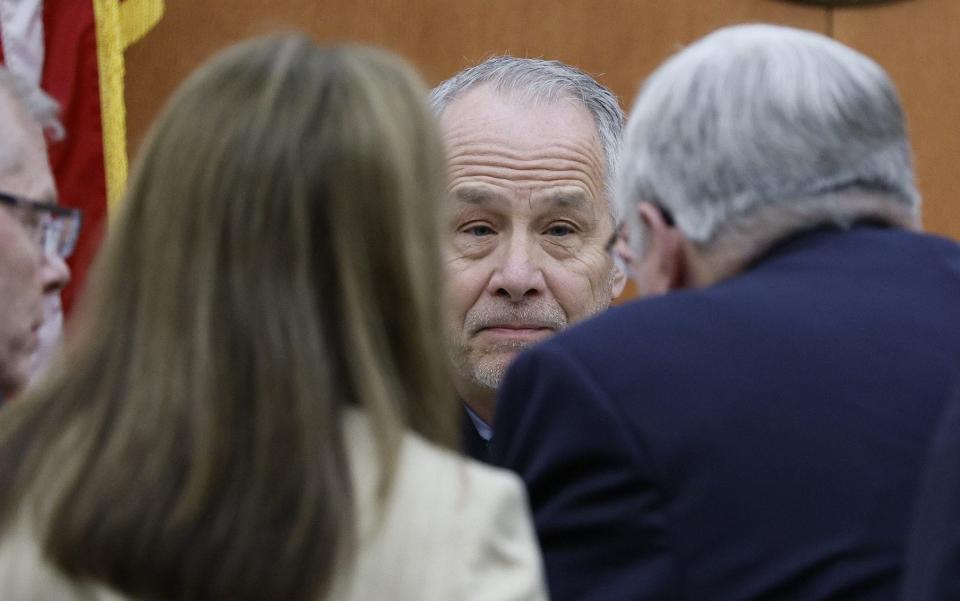Judge Kent Holmberg talks to lawyers from both sides in the case last week - Getty Images North America