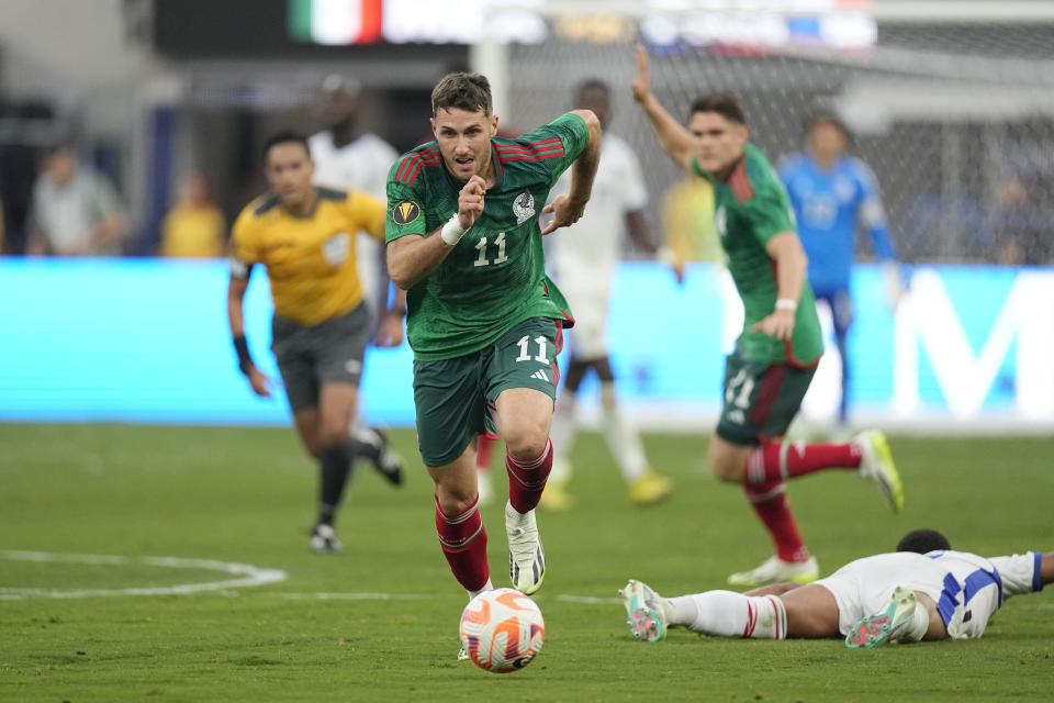 FILE - Mexico's Santiago Gimenez dribbles en route to scoring a goal during the second half of the CONCACAF Gold Cup final soccer match against Panama, Sunday, July 16, 2023, in Inglewood, Calif. Gimenez had a prolific season at Dutch club Feyenoord, making some Mexican watchers believe the team has a shot at winning the Copa America. (AP Photo/Mark J. Terrill, File)