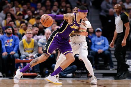 Nov 27, 2018; Denver, CO, USA; Denver Nuggets guard Malik Beasley (25) guards Los Angeles Lakers forward Kyle Kuzma (0) in the second quarter at the Pepsi Center. Mandatory Credit: Isaiah J. Downing-USA TODAY Sports