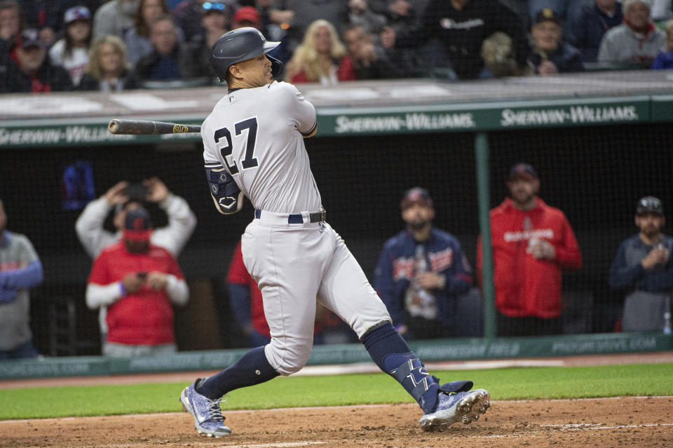 New York Yankees' Giancarlo Stanton swings and is struck out by Cleveland Guardians relief pitcher James Karinchak during the ninth inning of a baseball game in Cleveland, Monday April 10, 2023. (AP Photo/Phil Long)