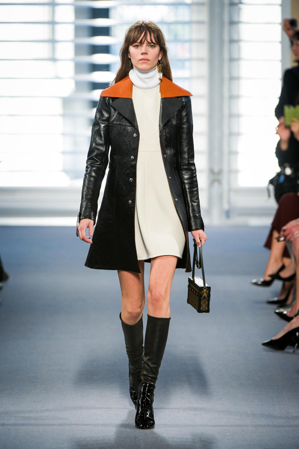 A model carries a Petite Malle bag in Louis Vuitton’s fall 2014 fashion show.