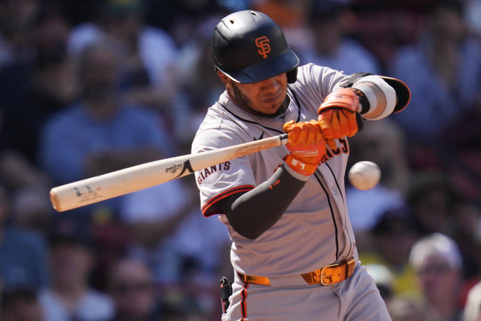 San Francisco Giants' Thairo Estrada swings for an RBI single during the seventh inning of a baseball game against the Boston Red Sox at Fenway Park, Thursday, May 2, 2024, in Boston. (AP Photo/Charles Krupa)