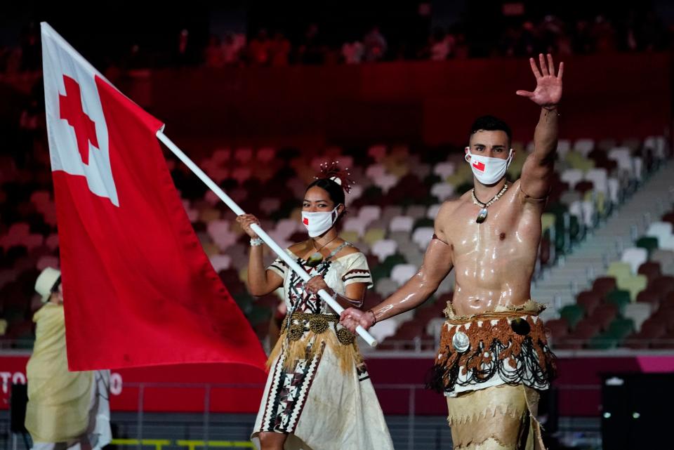 Tonga flag bearers Malia Paseka and Pita Taufatofua during the opening ceremony for the Tokyo 2020 Olympic Summer Games.