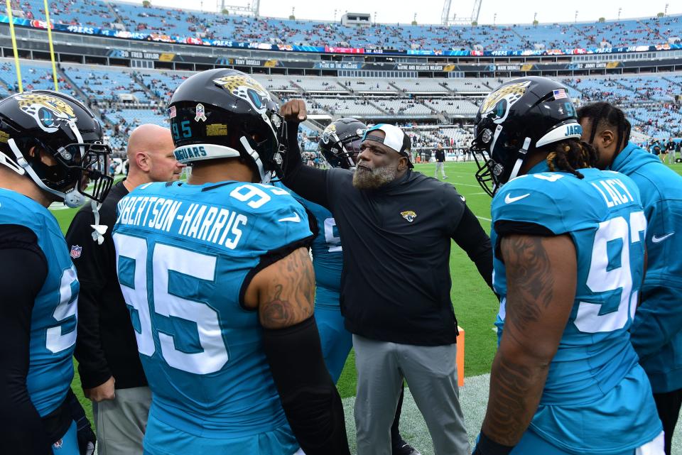 Jacksonville Jaguars defensive line coach Brentson Buckner gets his players pumped up before the start of Sunday's game against the San Francisco 49ers. The Jacksonville Jaguars hosted the San Francisco 49ers at EverBank Stadium in Jacksonville, FL Sunday, November 12, 2023. The Jaguars trailed 13 to 3 at the half. [Bob Self/Florida Times-Union]