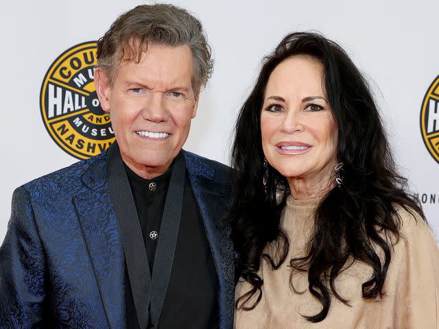 <p>Jason Kempin/Getty</p> Randy Travis and Mary Davis attend the class of 2022 Medallion Ceremony at Country Music Hall of Fame and Museum on October 16, 2022 in Nashville, Tennessee