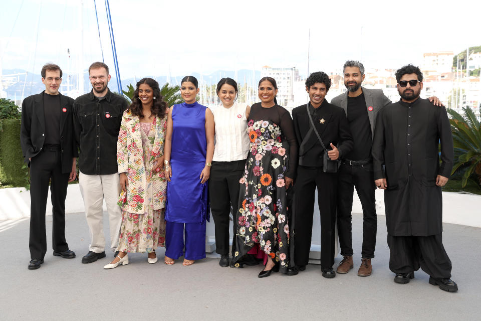 ‘All We Imagine As Light’ director Payal Kapadia and her producers Julien Graff and Thomas Hakim wearing the collective’s red badge at their photocall (Photo by Victor Boyko/Getty Images).