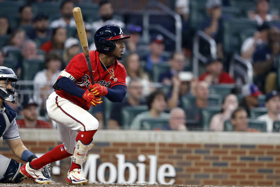 Atlanta Braves' Ozzie Albies lines out during the third inning of the team's baseball game against the Houston Astros, Friday, April 21, 2023, in Atlanta. (AP Photo/Butch Dill)