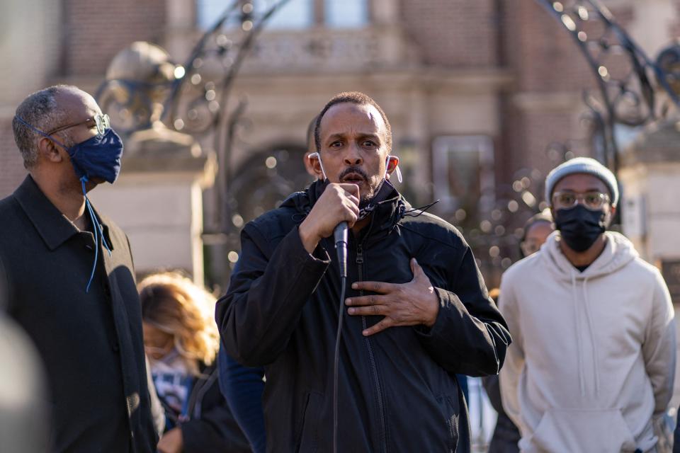 Bayle Gelle speaks outside Minnesota Governor's residence during a protest on March 6, 2021.