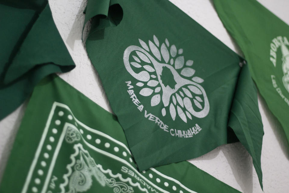 Green bandanas with the words "Marea Verde Chihuahua" hang from a wall at the organization's headquarters that supports reproductive rights in Chihuahua, Mexico, Monday, March 13, 2023. To safely advise women on self-managed medical abortions, members of Marea Verde Chihuahua were trained to become “acompañantes” -- capable of serving as a guide and partner, whether in person or from long distance. (AP Photo/Adriana Esquivel)