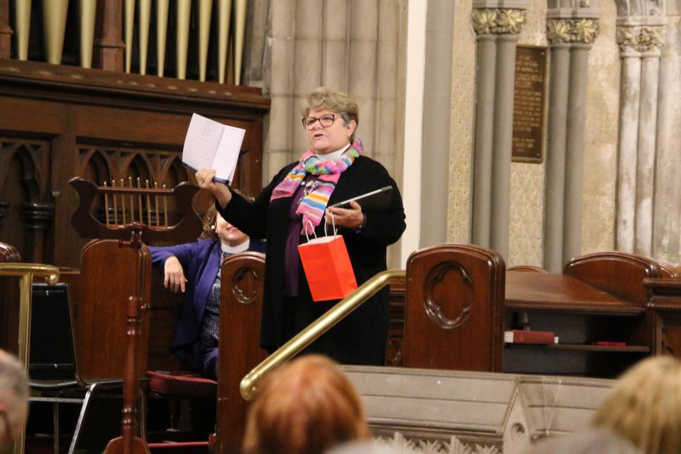 Bishop Duncan-Probe addresses Central New York Episcopalians gathered onsite at Grace Church, Utica and online during the Dec. 2 "Celebrate Dio CNY" event at which she introduced the Year of Joy. In this photo, she's holding a Joy Journal.