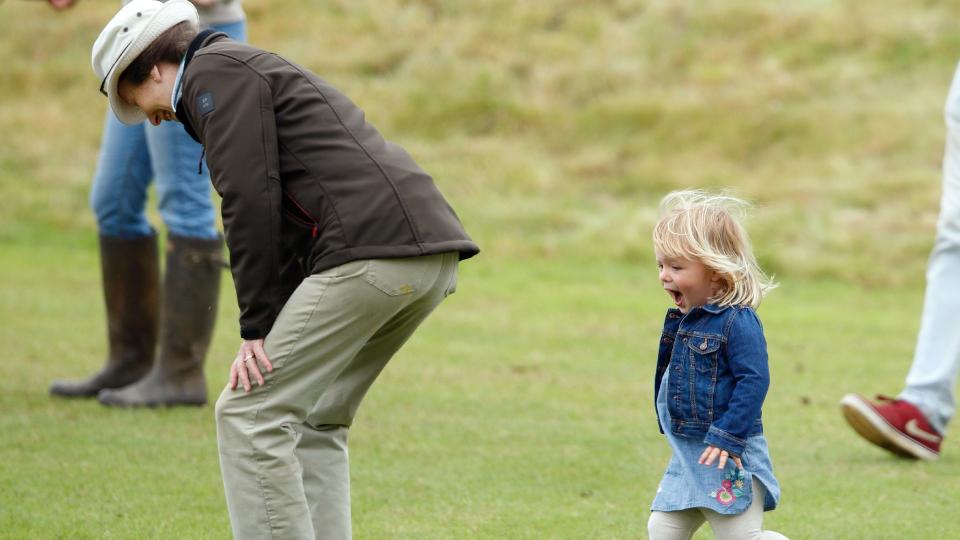 TETBURY, UNITED KINGDOM - JUNE 19: (EMBARGOED FOR PUBLICATION IN UK NEWSPAPERS UNTIL 48 HOURS AFTER CREATE DATE AND TIME) Princess Anne, The Princess Royal plays with granddaughter Mia Tindall as they watch Zara Phillips play in a Jockeys vs Olympians charity polo match at the Beaufort Polo Club on June 19, 2016 in Tetbury, England.