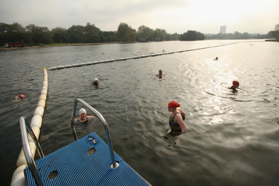 Swimmers Take An Early Dip In The Serpentine Lido