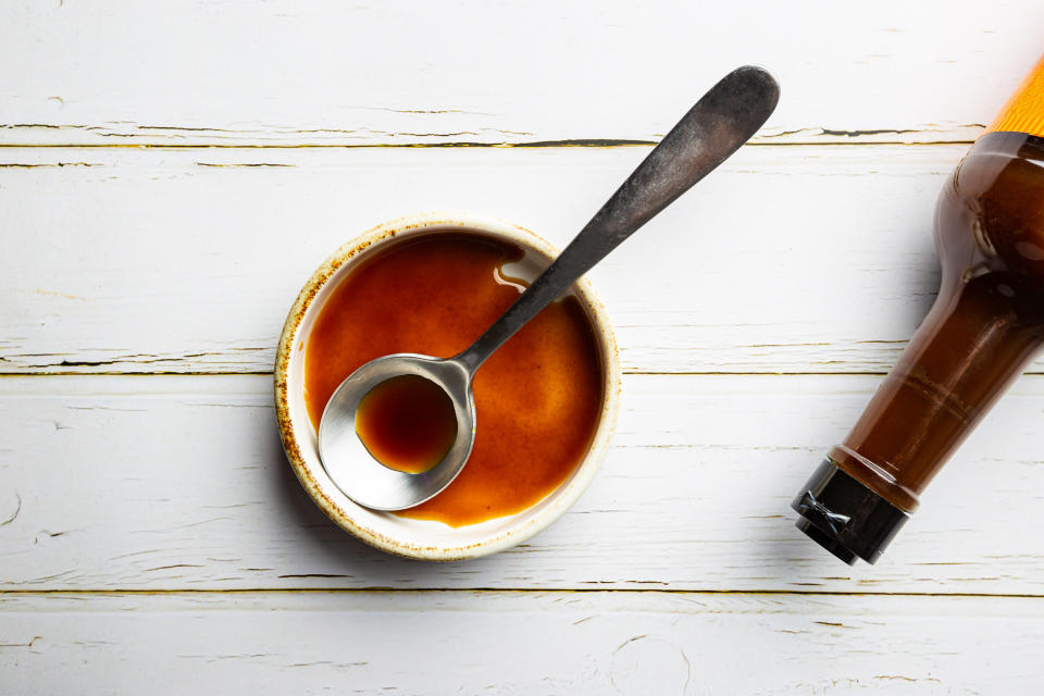 Worcestershire sauce in a small bowl with a spoon