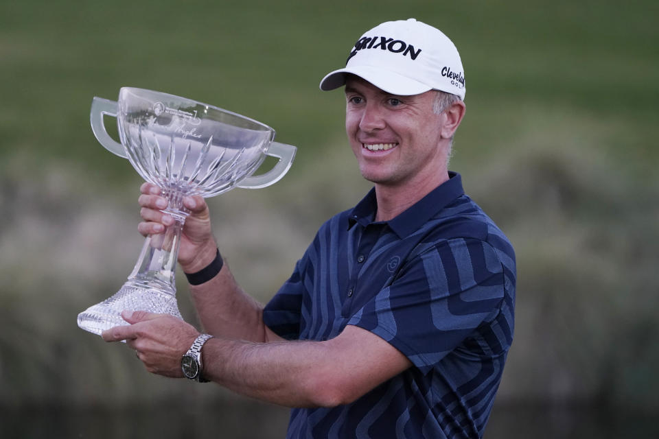 Martin Laird holds the trophy after winning the Shriners Hospitals for Children Open golf tournament Sunday, Oct. 11, 2020, in Las Vegas. (AP Photo/John Locher)