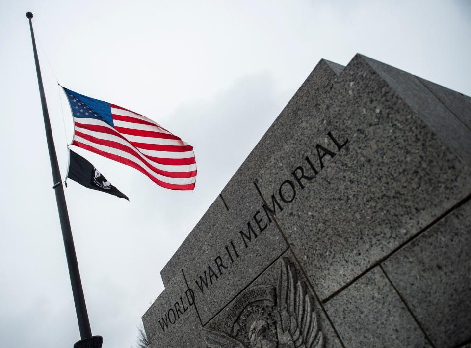 The U.S. flag flies at half-staff at the World War II Memorial in tribute to former President George H. W. Bush, on Dec. 1, in Washington, D.C. (Photo: Andrew Caballero-Reynolds/AFP/Getty Images)