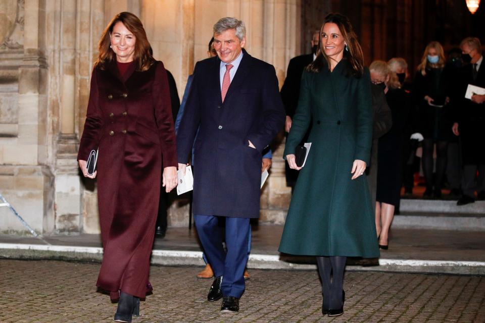 Like mother, like daughter: Carole and Pippa Middleton in bias-cut coats - REUTERS